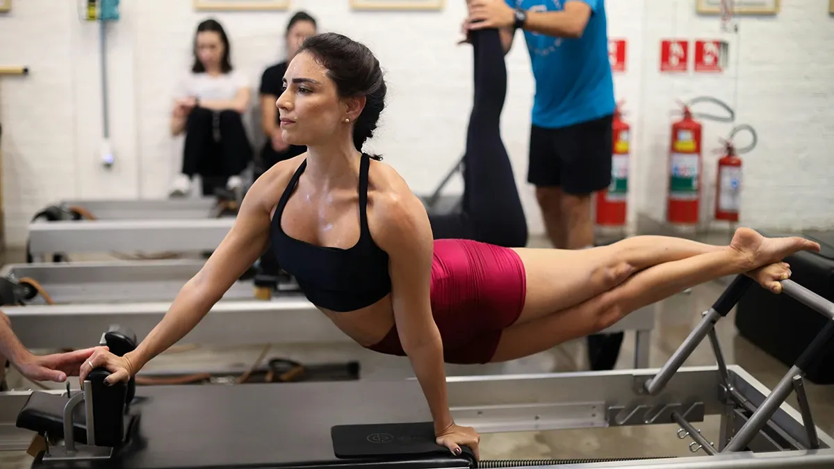 A one on one yoga session with Laura May in a studio