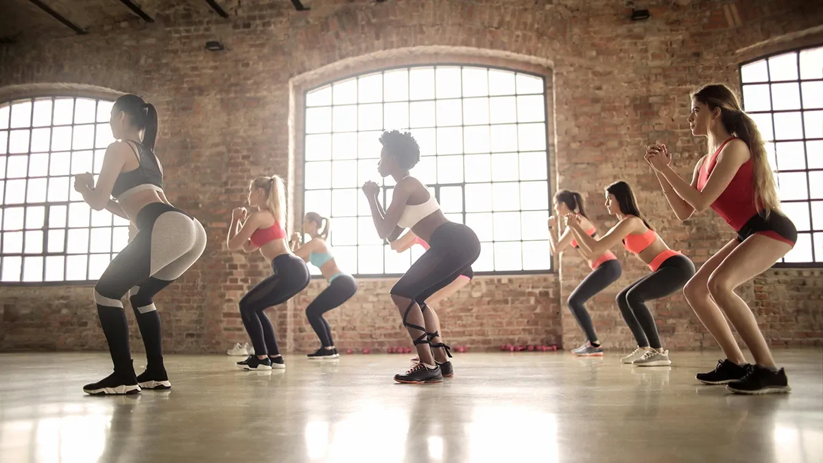 A group mat pilates session with Laura May in a studio