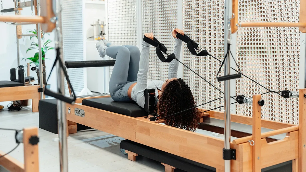 A one on one yoga session with Laura May in a studio