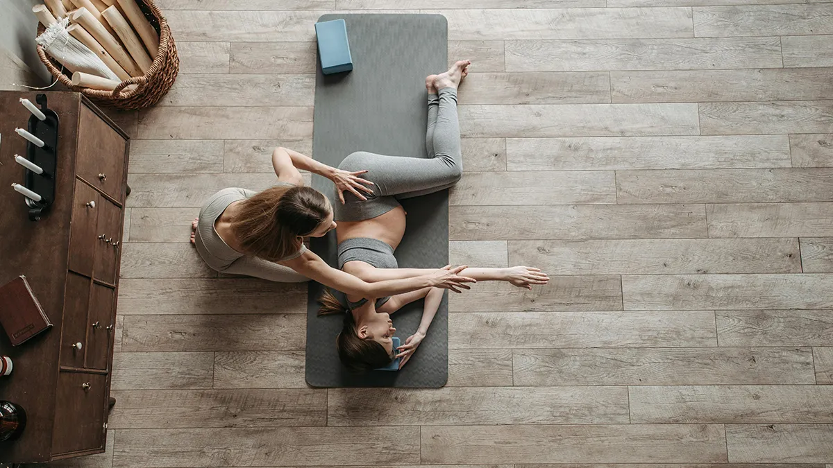 A one on one yoga session with Laura May on the beach